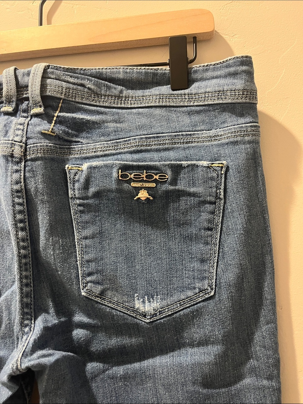 bebe Distressed Light Blue Denim Jeans with Logo Pin